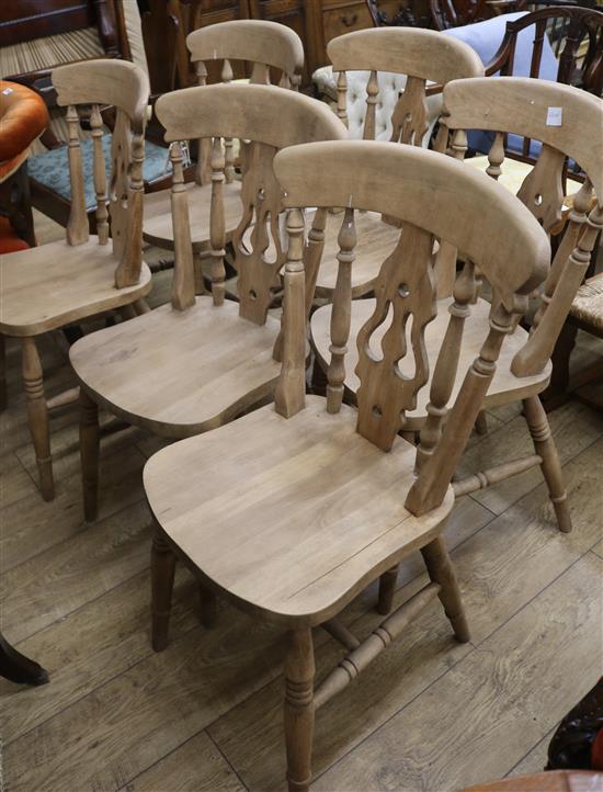 A set of six beech solid seat kitchen chairs
